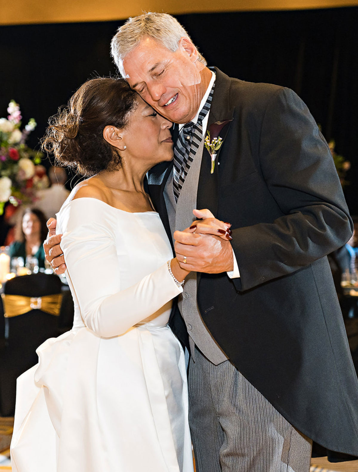 A middle-aged couple celebrating their milestone wedding day.